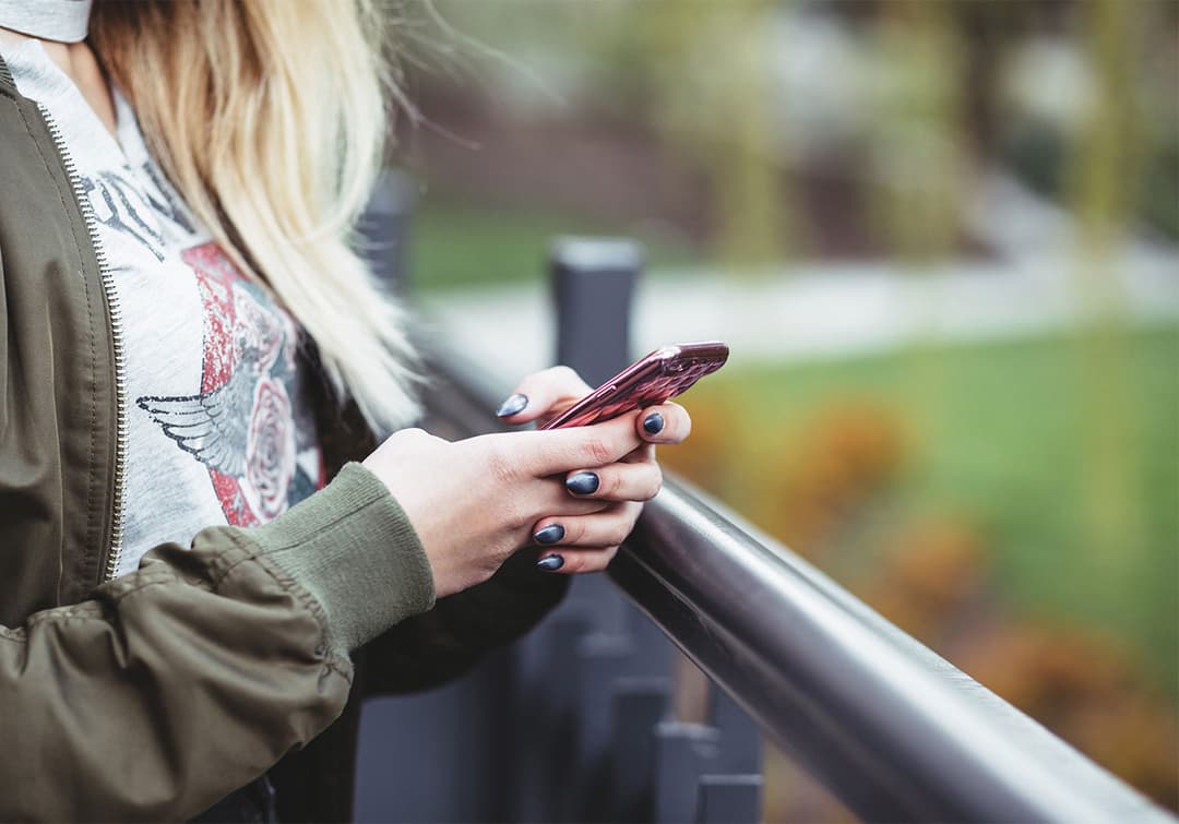 Customer using contactless ordering on smartphone in restaurant