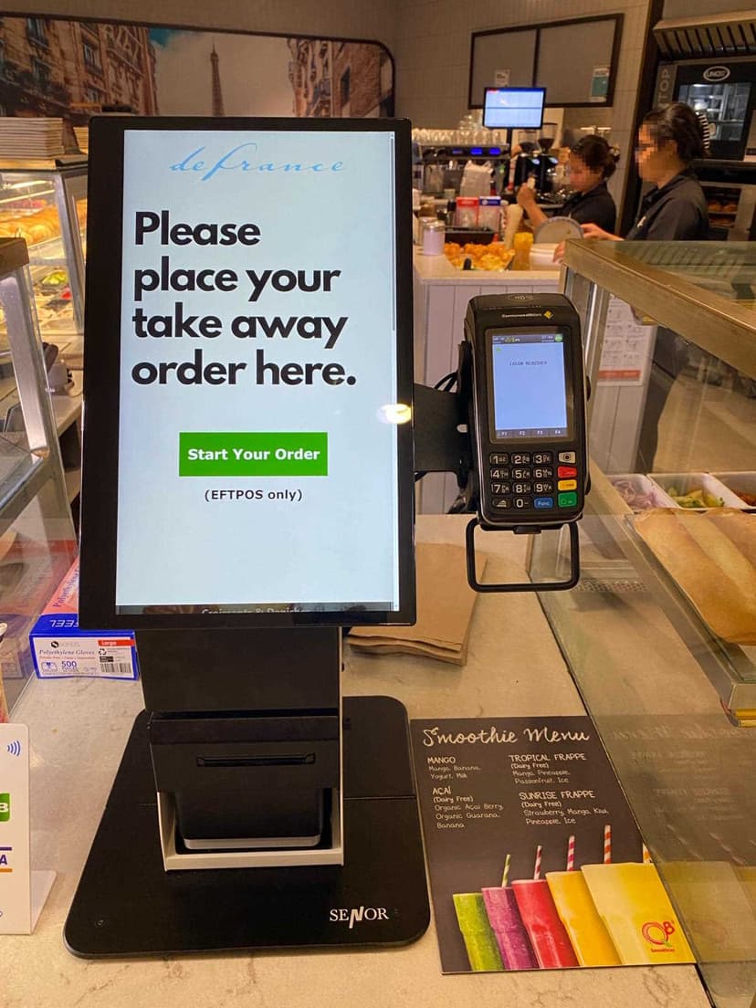 Counter-top self-serve kiosk displaying menu